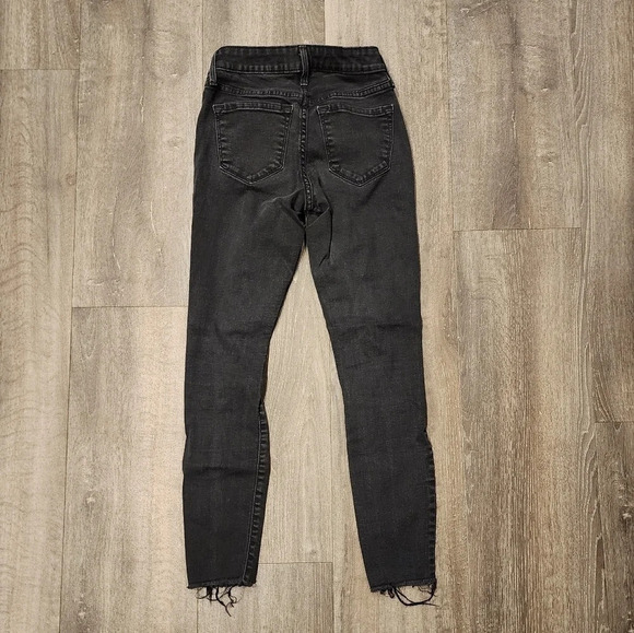 Old Navy Mid Rise Rockstar Black Distressed Jean - Picture 6 of 7